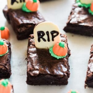 An easy Halloween Brownie with a cookie gravestone and a candy pumpkin.
