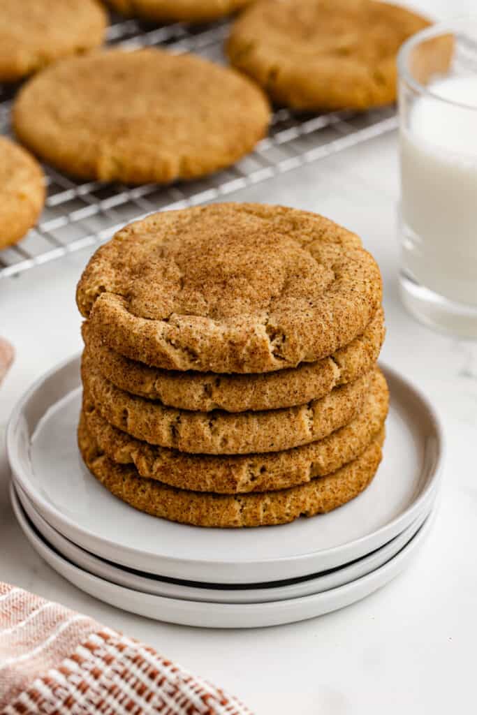 A stack of Pumpkin Snickerdoodle cookies on a white plate.