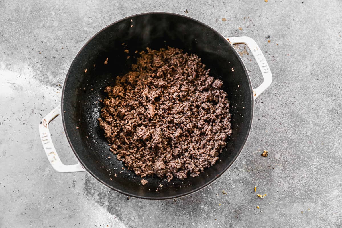 A pot of cooked ground beef, broken into pieces.