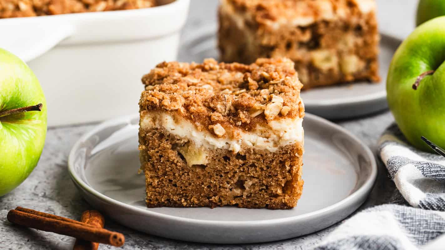 The best Apple Coffee Cake recipe has a moist apple cake with a cream cheese layer and golden streusel on top. It's absolutely perfect!