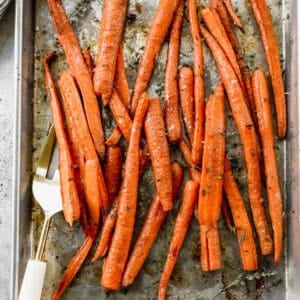 A pan filled with easy Balsamic Roasted Carrots, fresh out of the oven.