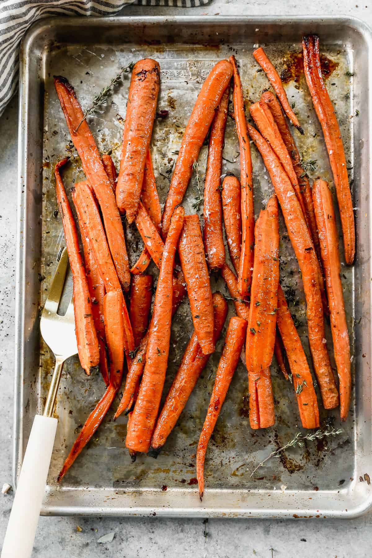 A pan filled with easy Balsamic Roasted Carrots, fresh out of the oven.