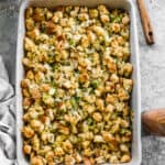 Easy Cornbread Dressing in a 9x13 white baking dish, ready to serve.