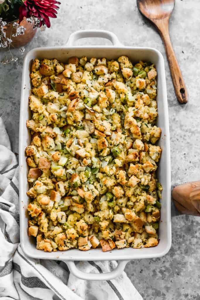 Easy Cornbread Dressing in a 9x13 white baking dish, ready to serve.