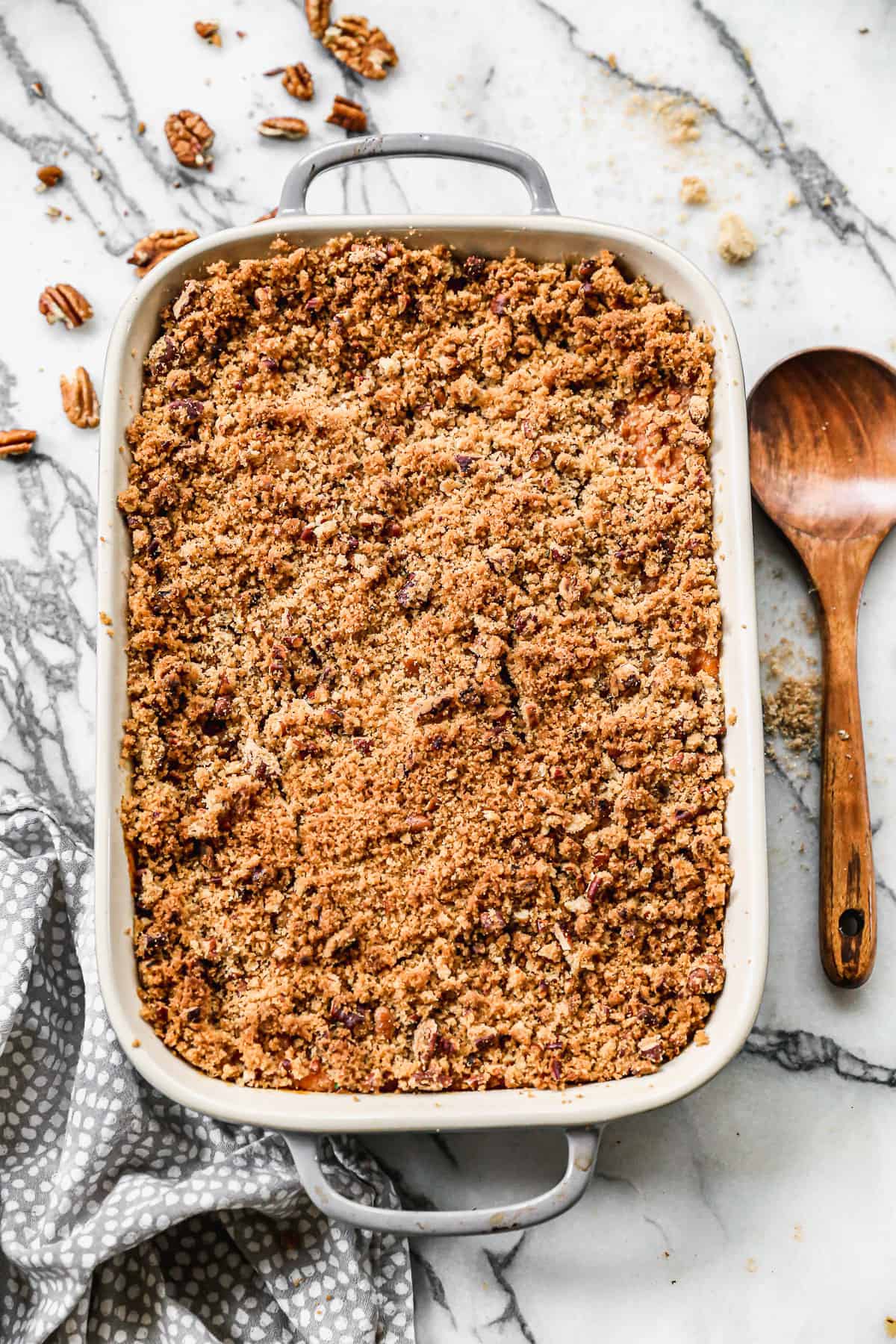 A Sweet Potato Casserole with pecan topping, golden brown and ready to serve.