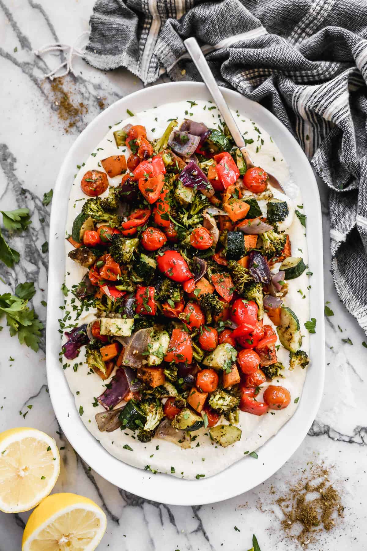 A whipped feta recipe with roasted vegetables on a bed of whipped feta.