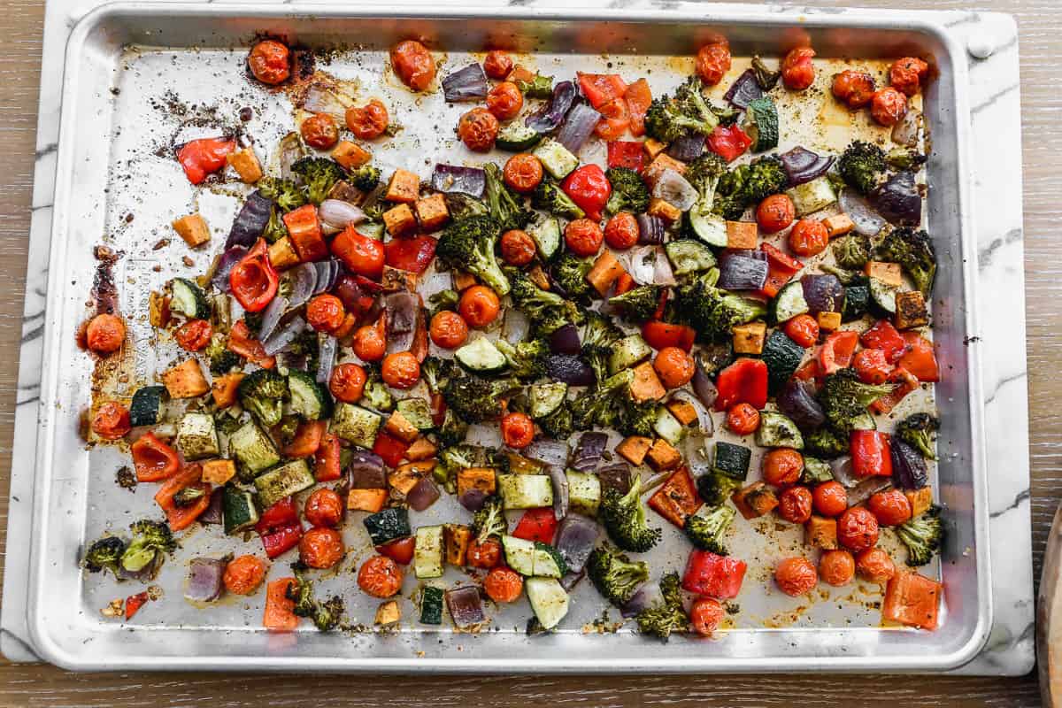Roasted vegetables on a baking sheet, fresh out of the oven. 