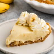 A slice of homemade Banana Cream Pie on a plate, ready to enjoy.