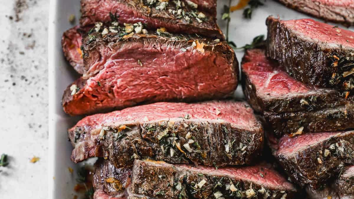 The best Beef Tenderloin Roast is covered in a garlic herb butter, and every bite melts in your mouth. Serve with a homemade orange infused horse radish sauce!