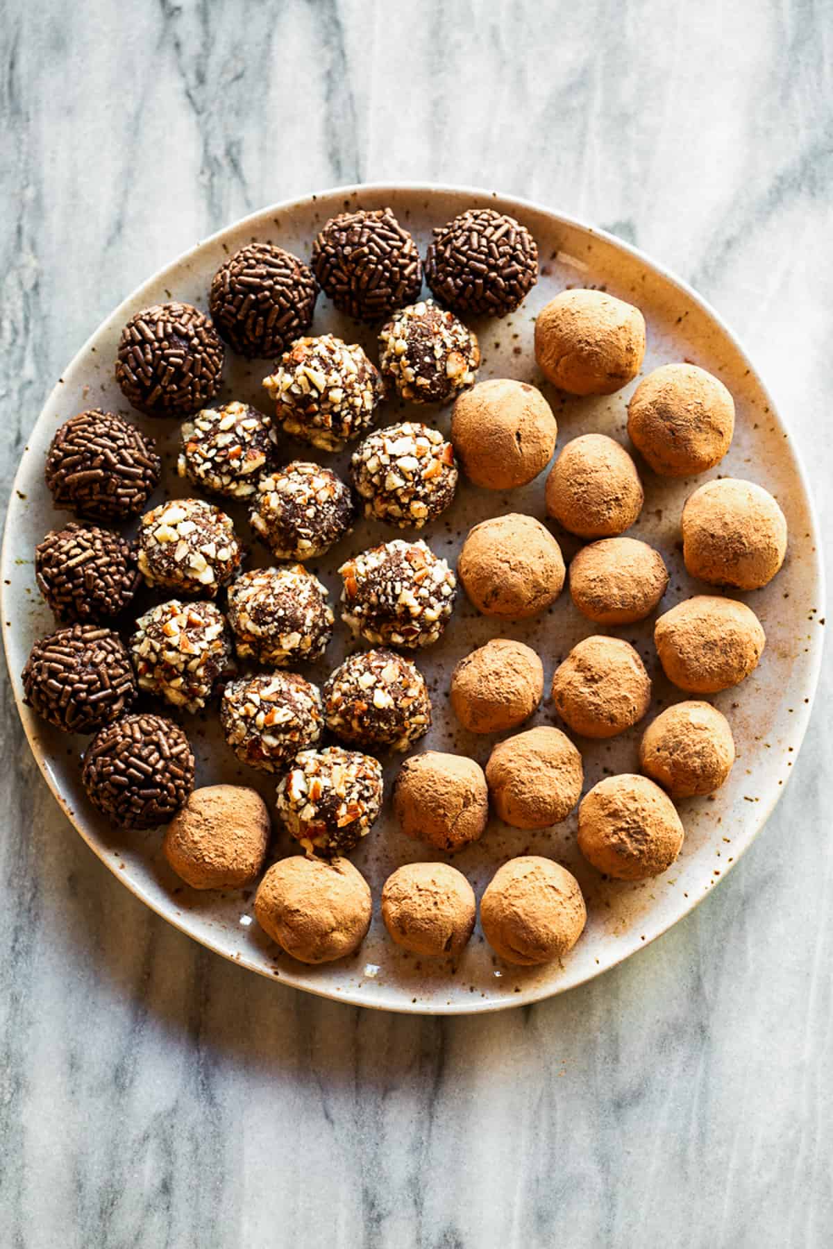 An assortment of holiday truffles on a platter.