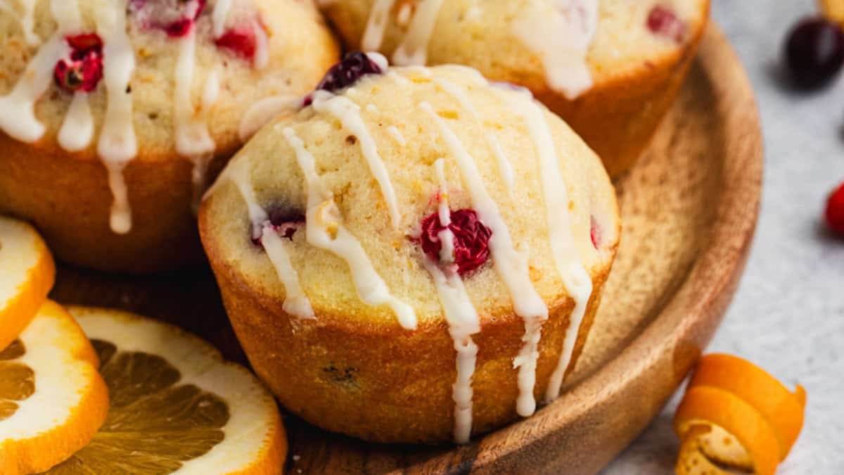 The best Cranberry Orange Muffins are fluffy, moist and drizzled with an orange glaze.