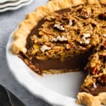 An easy German Chocolate Pie recipe with a slice missing.