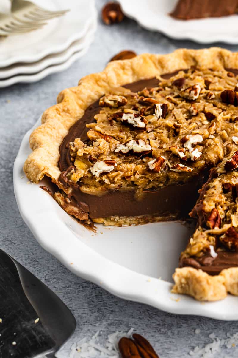 An easy German Chocolate Pie recipe with a slice missing. 