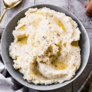 This easy Mashed Potatoes recipe will steal the show at dinner! They are better than the restaurant - light, fluffy, and perfect!