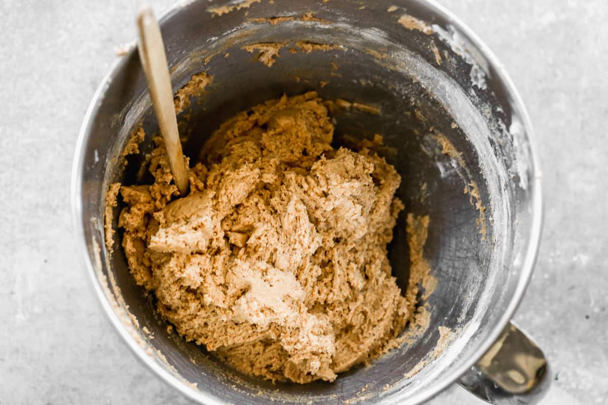A mixing bowl with peanut butter cookie dough. 