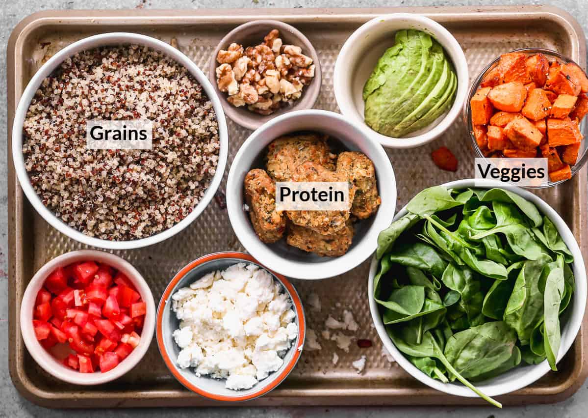All of the ingredients needed to make an easy Buddha Bowl recipe filled with grains, protein, and veggies.
