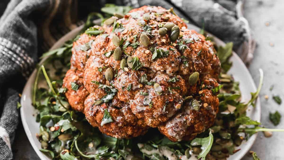 This easy Whole Roasted Cauliflower recipe only takes a few minutes to prep and is bursting with flavor!