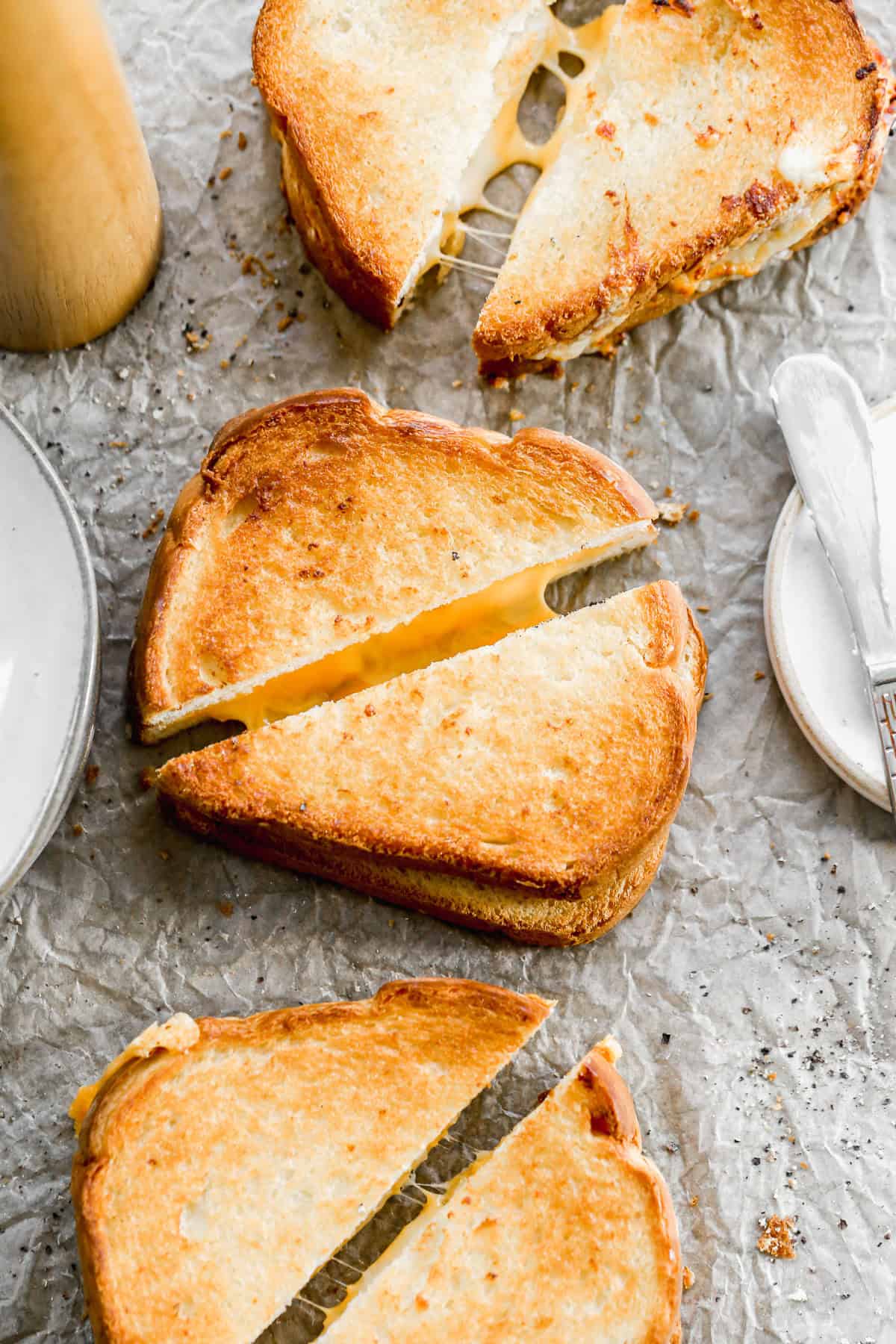 The best Air Fryer Grilled Cheese Sandwiches golden and crunchy and cut in half to show the melted center.