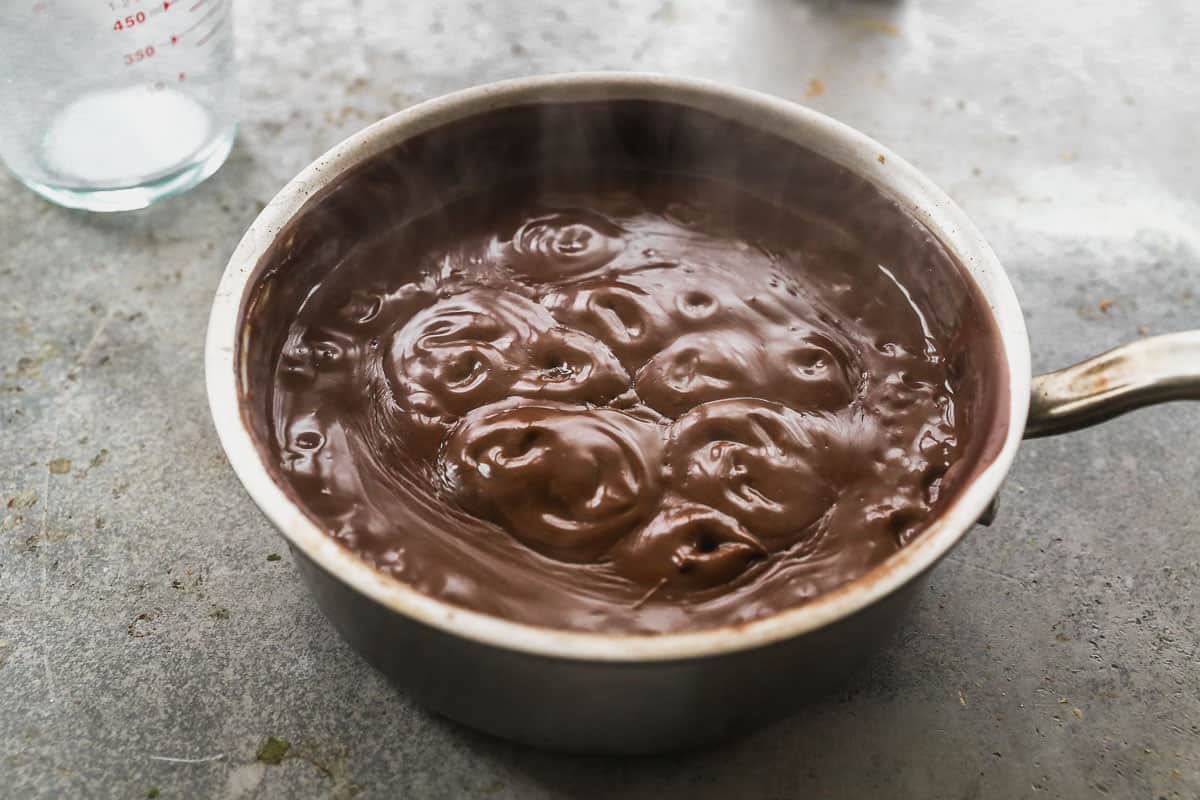 The best chocolate pudding recipe simmering in a saucepan.