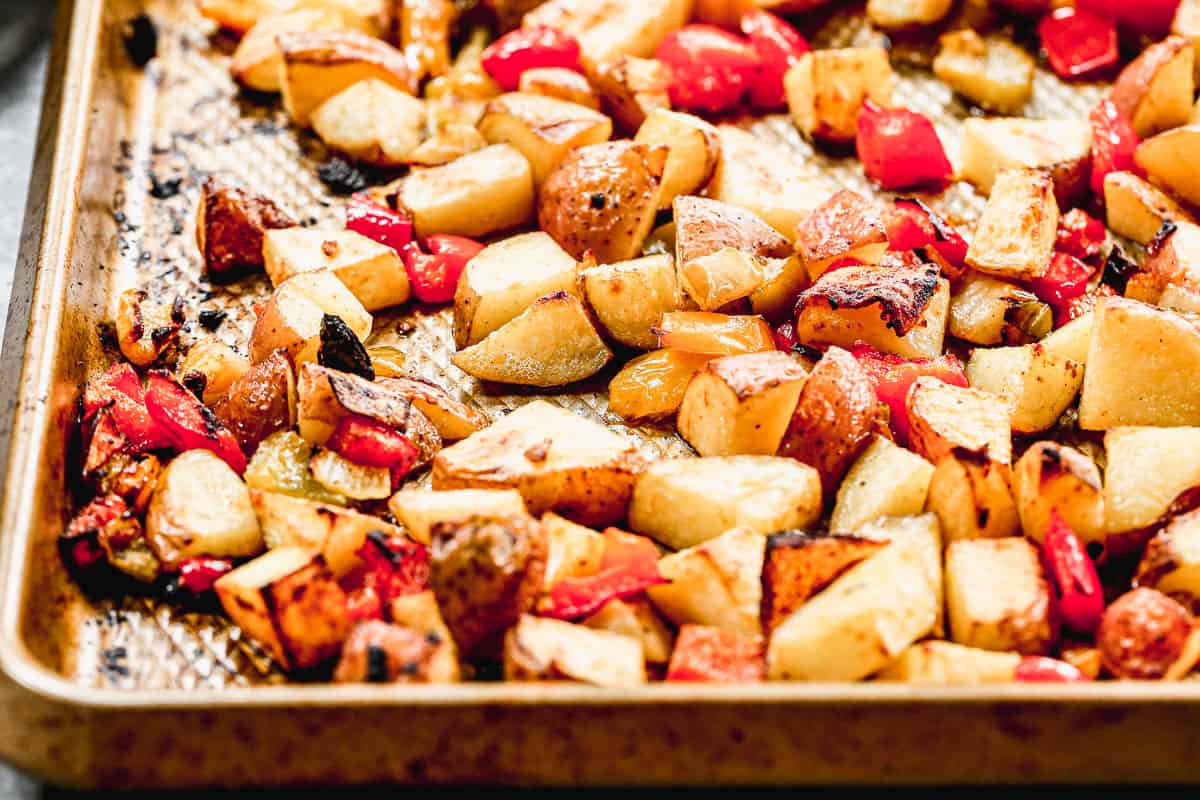 The best Breakfast Potatoes recipe on a baking sheet, roasted until crispy to show how to make breakfast potatoes.