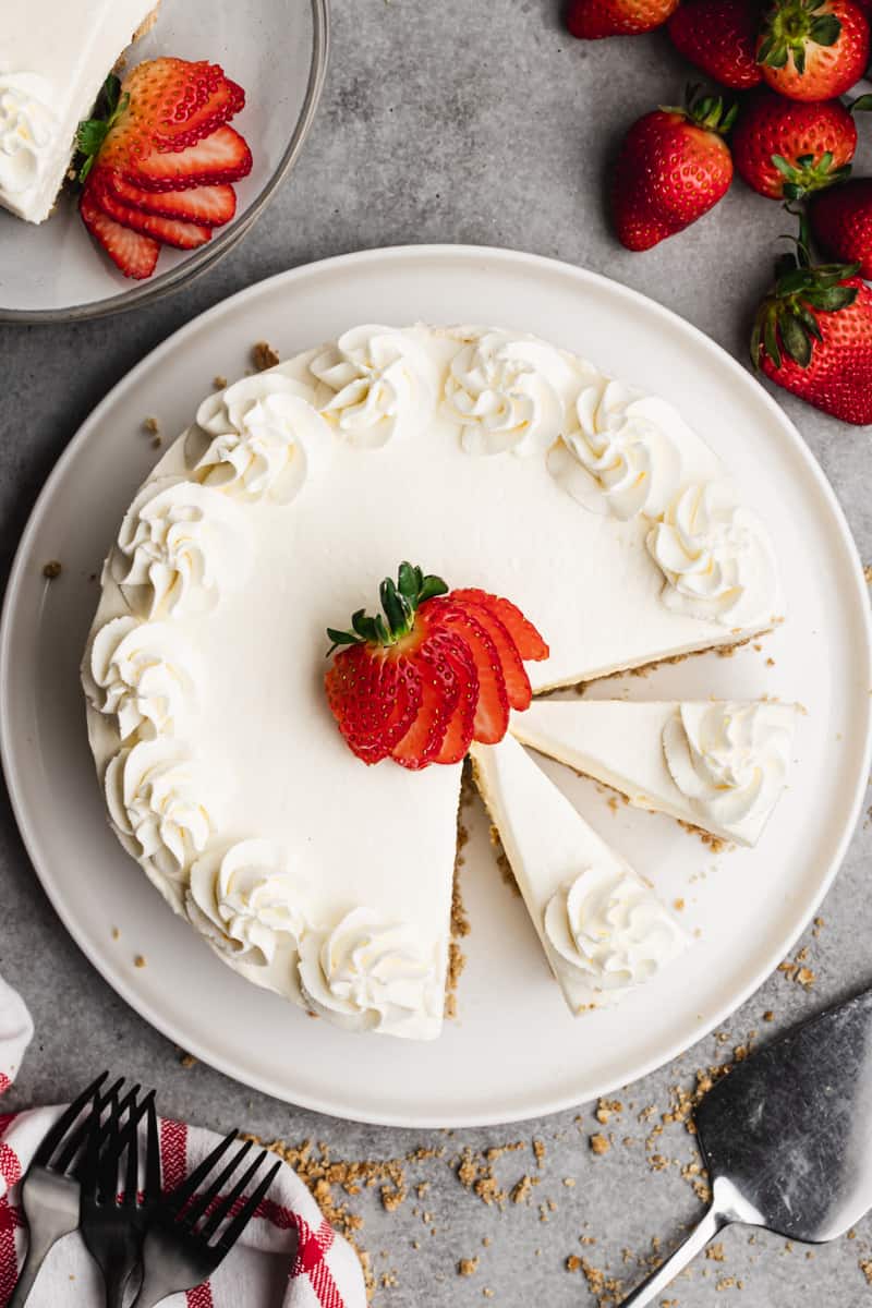 An easy No Bake Cheesecake Recipe with a sliced strawberry in the center, ready to enjoy.