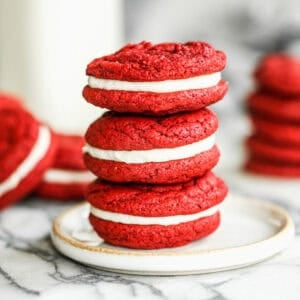 These Red Velvet Oreo cookies are soft, chewy, and have a smooth cream cheese frosting in the middle. They are festive, fun to make, and so tasty to eat!