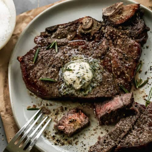 This Air Fryer T-Bone Steak recipe tastes like it came off the grill! It has that seared crust while staying juicy inside. Top it with a quick herb better for a truly gourmet meal in 20 minutes!