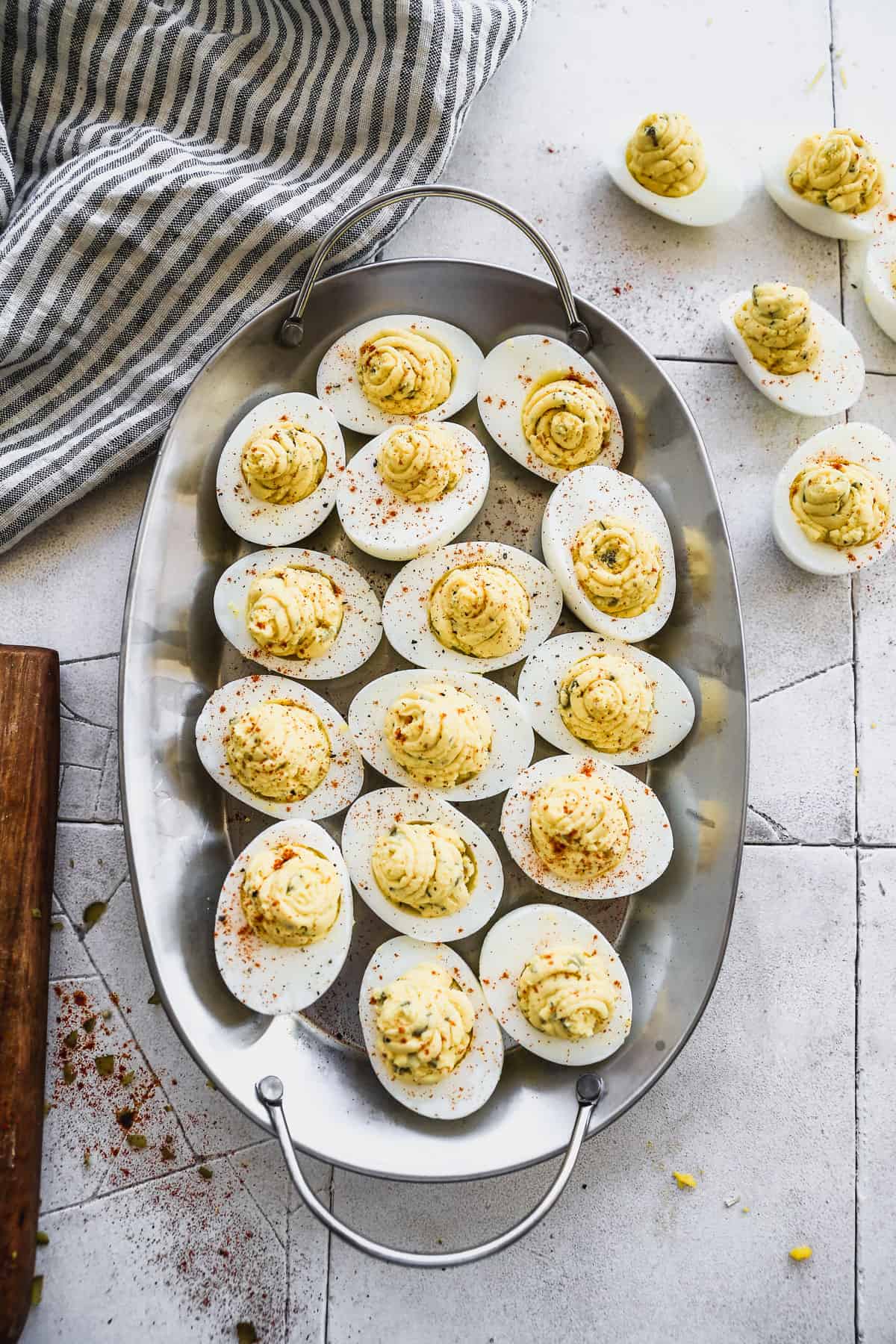 A platter of easy Deviled Eggs, topped with paprika, ready to serve.
