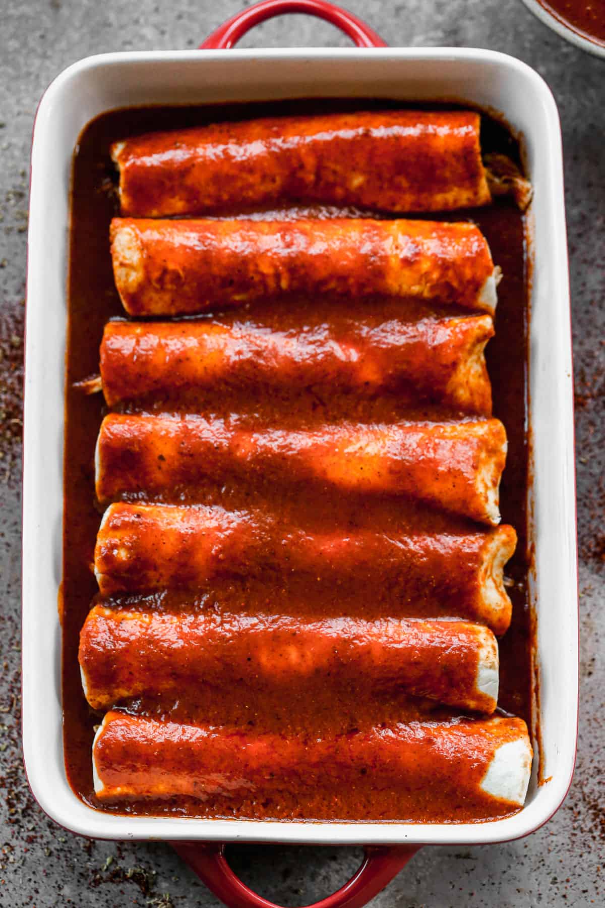 A simple Mexican enchilada sauce recipe, poured on top of cheese enchiladas.