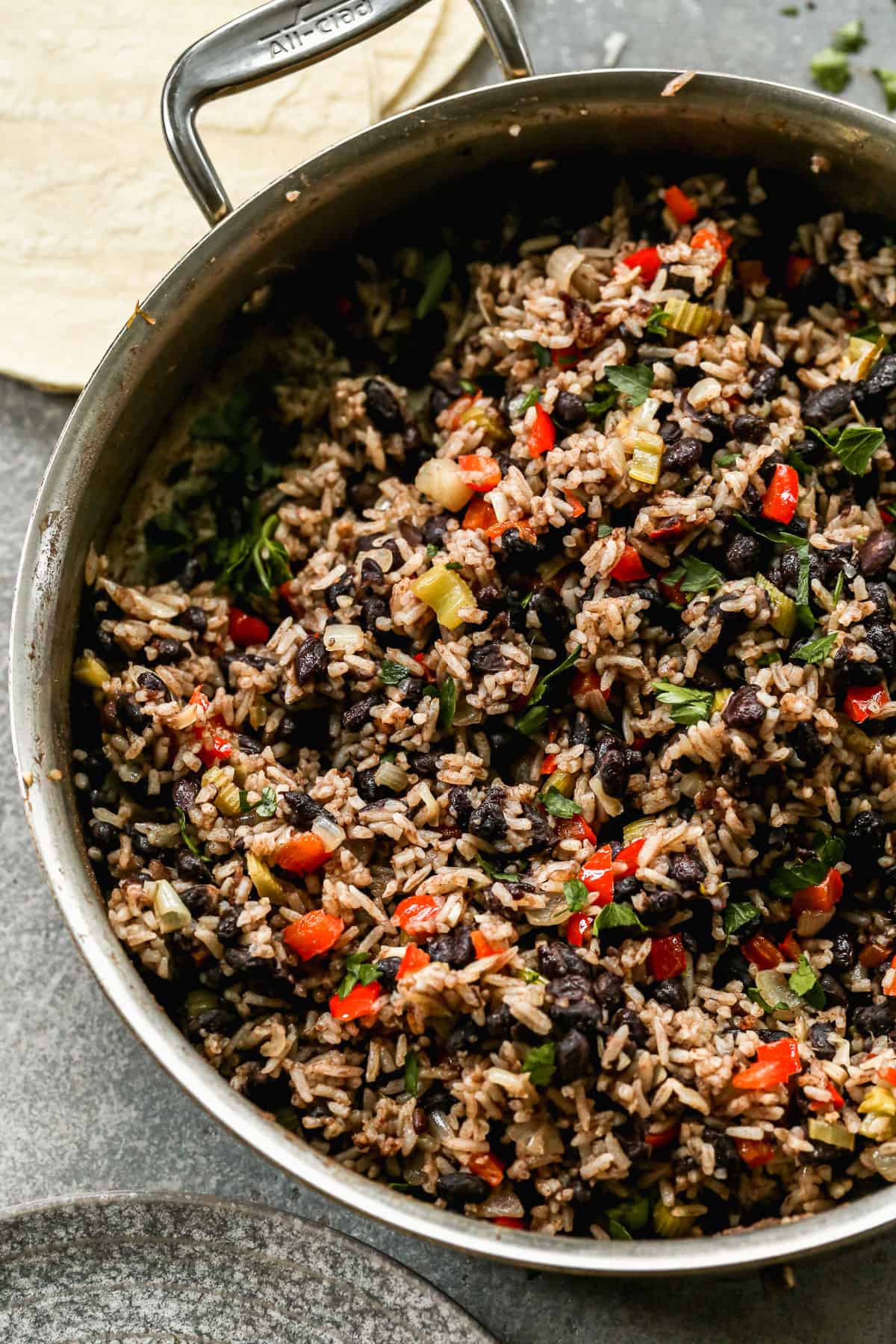 An easy gallo pinto recipe in a stainless steel pan, ready to serve.