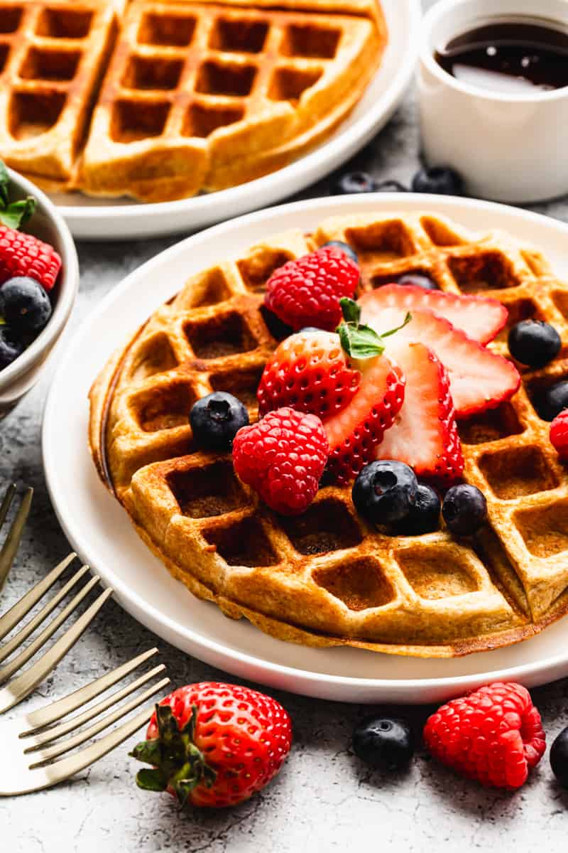 High protein waffles topped with fresh berries. 