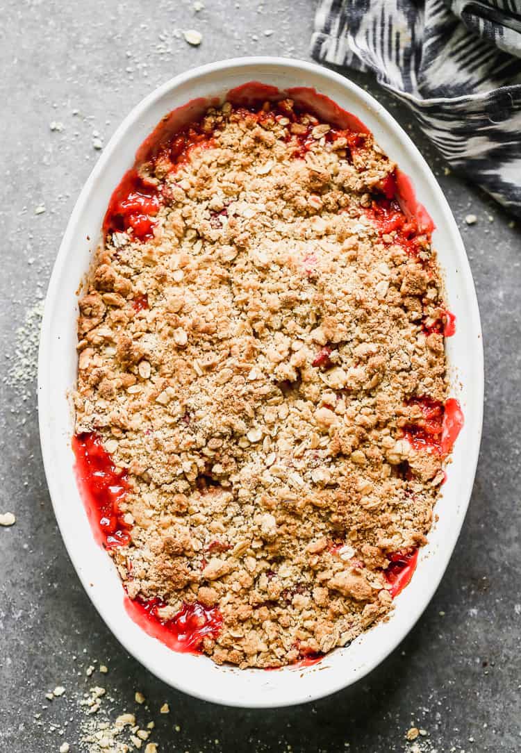 Rhubarb crisp baked in a dish with crumble oat topping.