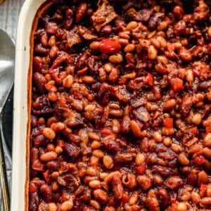 This BBQ Baked Beans recipe are flavorful with bacon and a homemade bubbly sauce. They only take 15 minutes to prep and are better than any can!