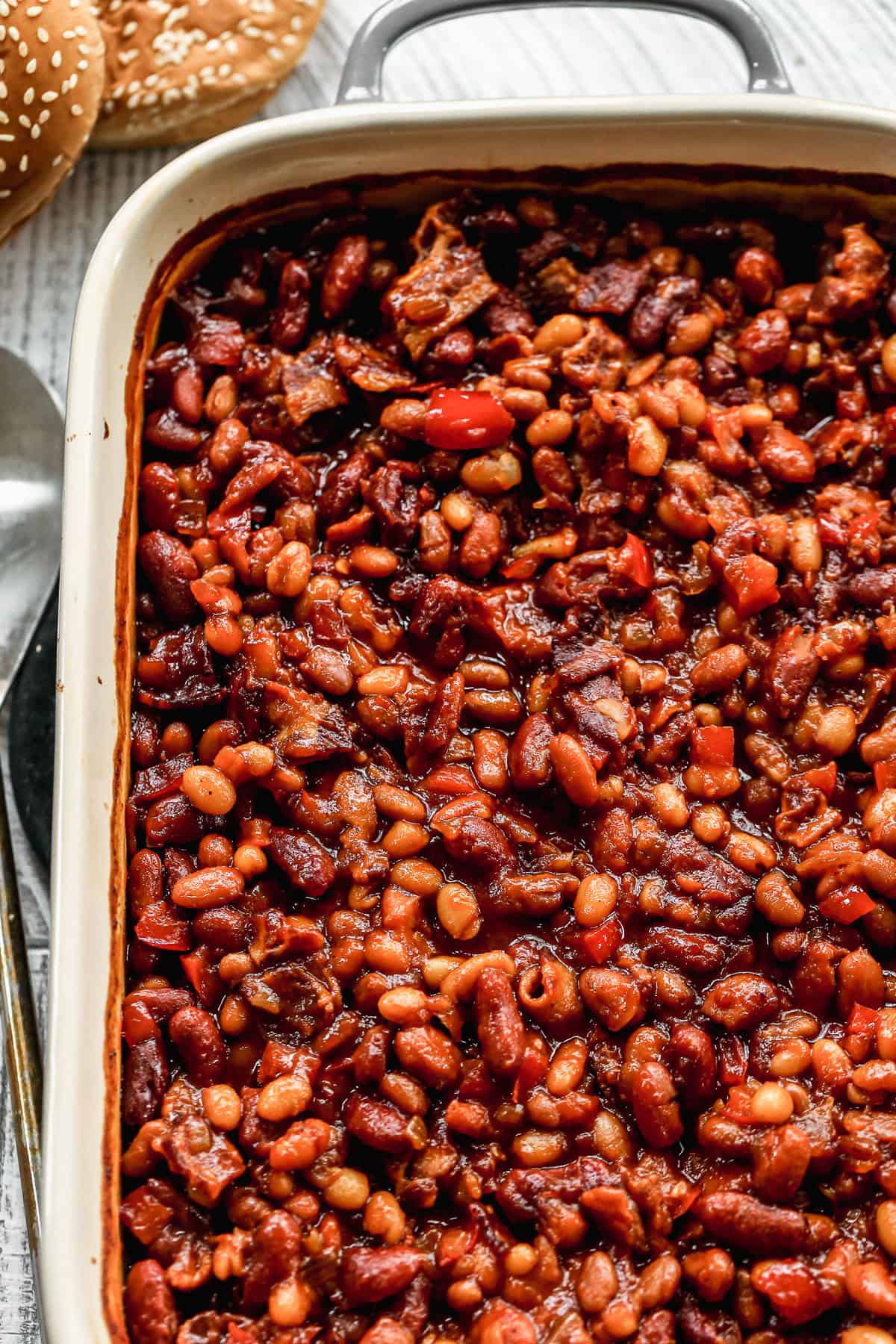 This BBQ Baked Beans recipe are flavorful with bacon and a homemade bubbly sauce. They only take 15 minutes to prep and are better than any can!