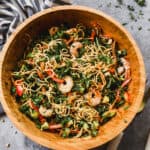 An easy Noodle Salad with chopped veggies shrimp, and a simple vinaigrette, served cold.