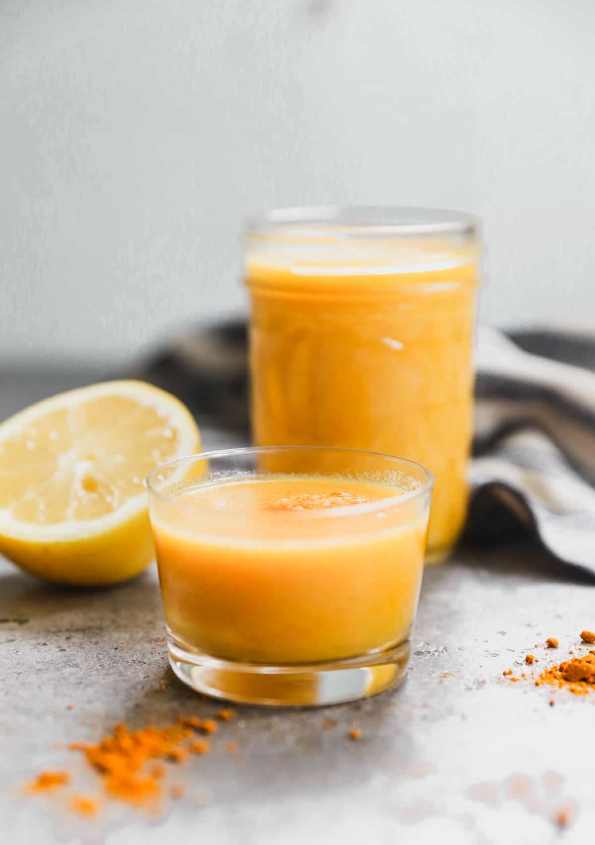 Lemon Ginger Shots recipe in a little glass, ready to enjoy.