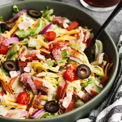 Italian Grinder Salad with all of the ingredients chopped, served in a large bowl.