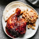An easy mole recipe served over chicken with Mexican rice and tortillas on the side.