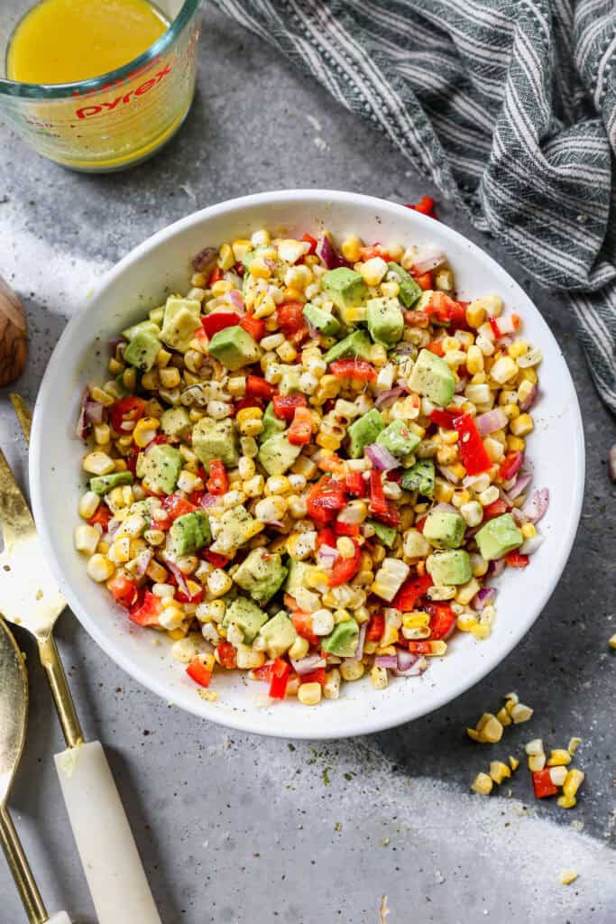 corn salad in a white bowl.