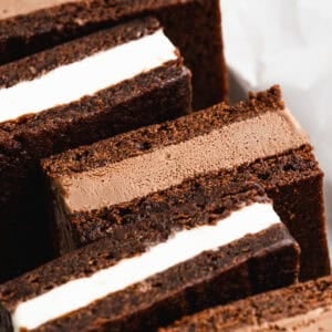 This homemade Ice Cream Sandwiches recipe is easier than you think with homemade brownies and your favorite ice cream inside. Make a big batch and pull them out of the freezer all summer!