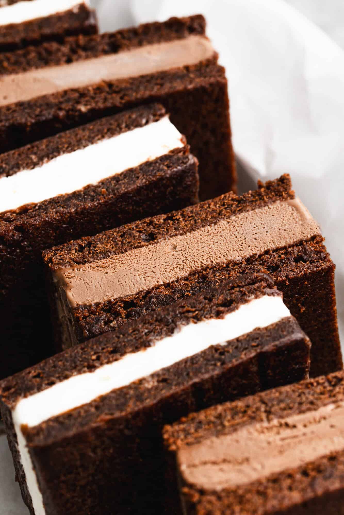 This homemade Ice Cream Sandwiches recipe is easier than you think with homemade brownies and your favorite ice cream inside. Make a big batch and pull them out of the freezer all summer!