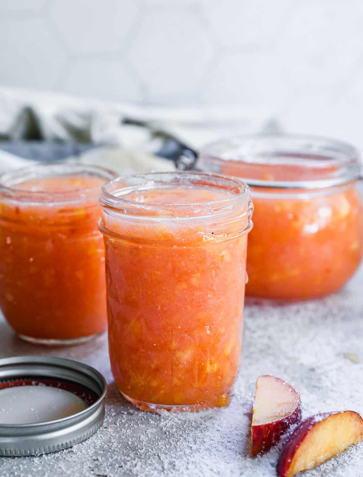 Homemade Peach Jam in glass jars, ready to enjoy!