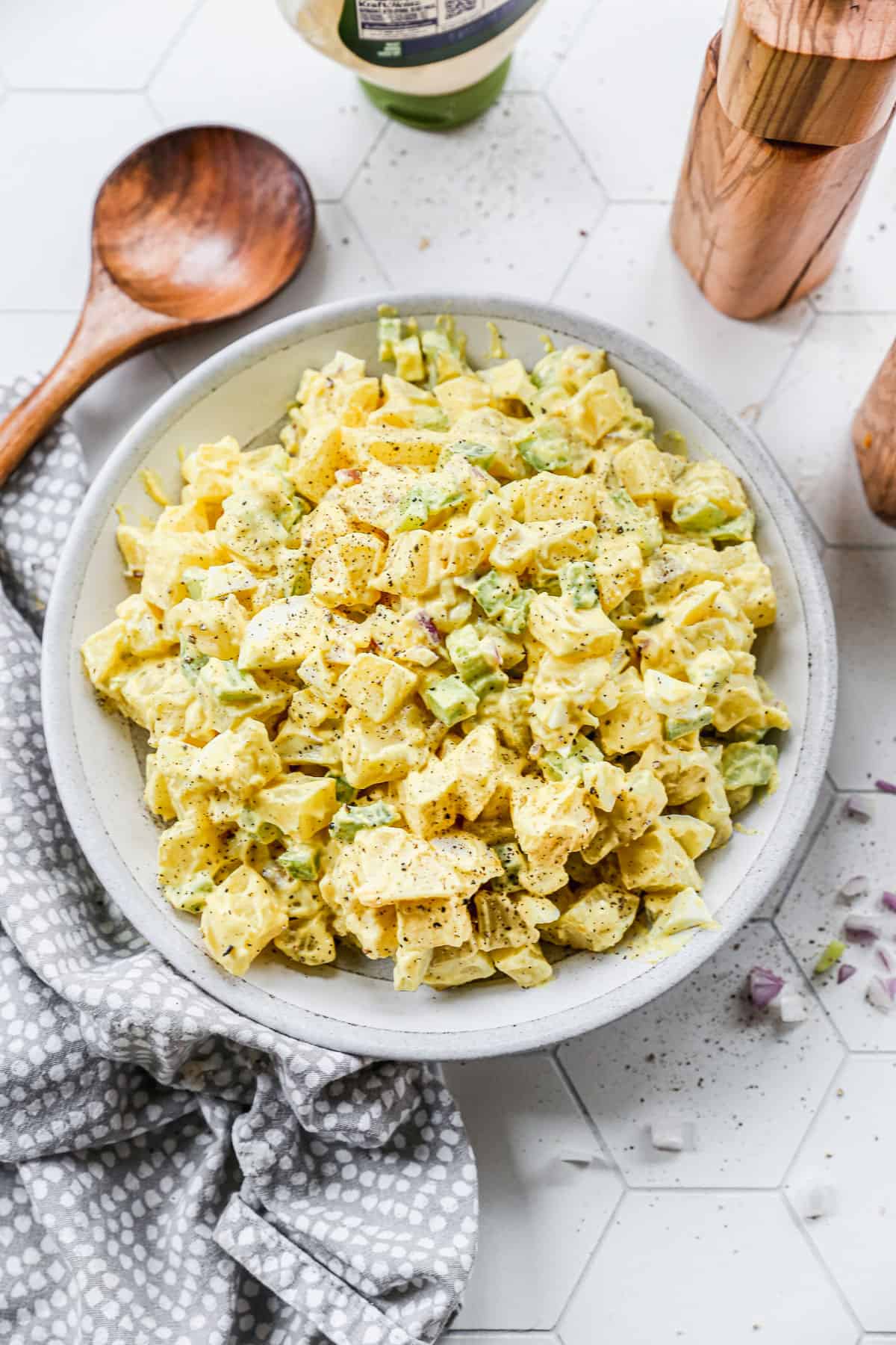 The best Potato Salad recipe with boiled eggs, celery, and chopped potatoes all covered in a creamy dressing. 