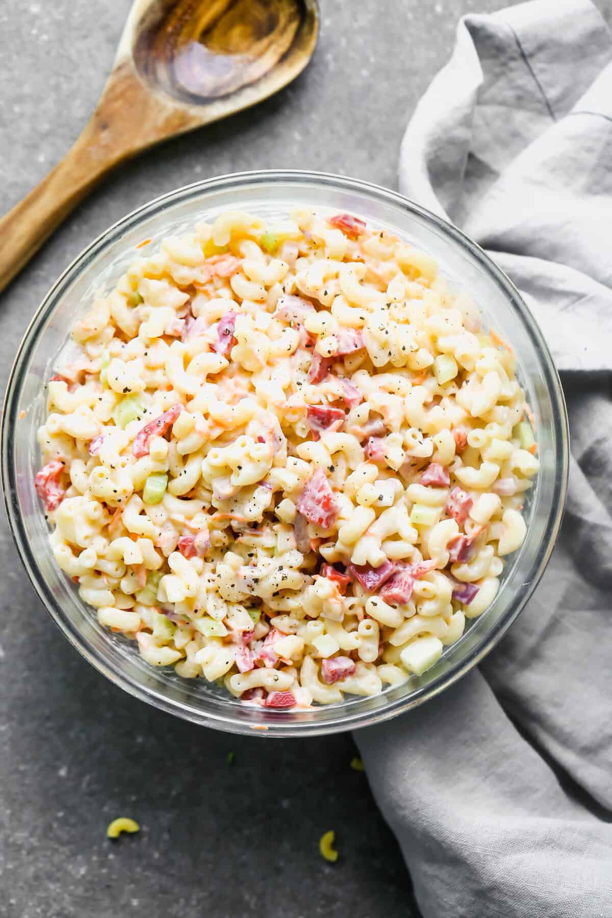 Mac Salad served in a bowl, made with a creamy dressing, noodles and diced veggies.