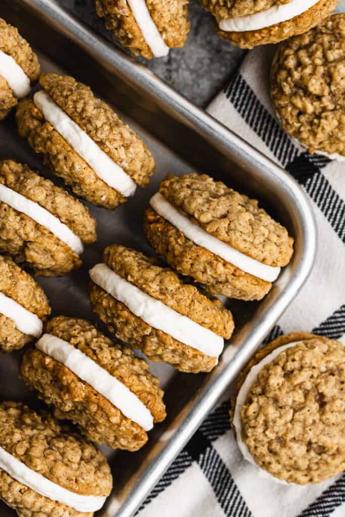 Homemade Oatmeal Cream Pies recipe with a filling, lined in a pan and ready to serve.