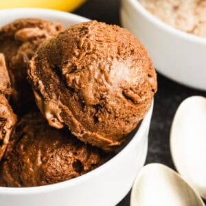 A bowl of easy Chocolate Protein Ice Cream with vanilla in the back.