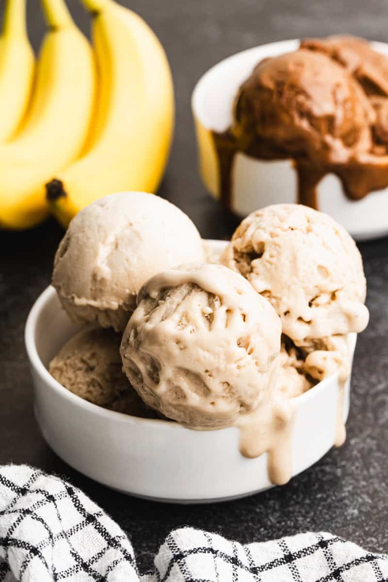 Two bowls of easy Protein Ice Cream one in a vanilla flavor and one in chocolate, ready to enjoy.