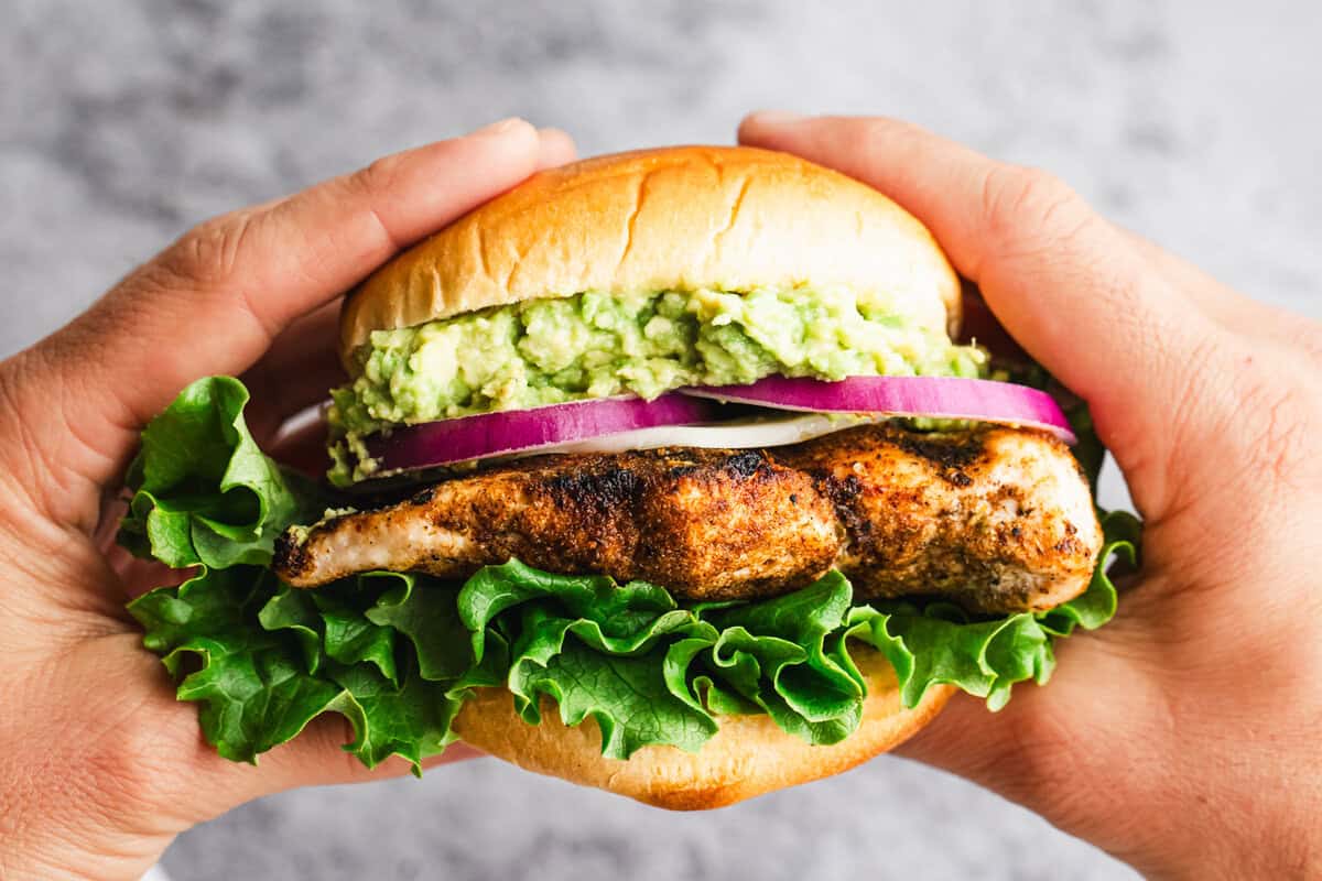 This homemade Grilled Chicken Sandwich recipe will knock any restaurant version out of the park! We have a well seasoned chicken breast topped with fresh veggies and avocado on a toasted bun. 