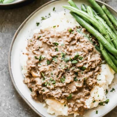 This simple Hamburger Gravy recipe is affordable, easy, and on the table in 20 minutes. Best part, my kids devour it every single time!