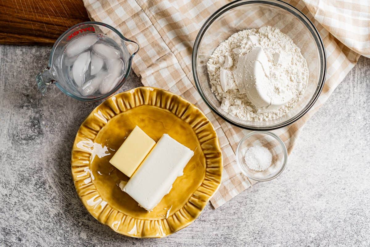 You only need a few simple ingredients for homemade pie crust: flour, salt, butter, shortening, and water!